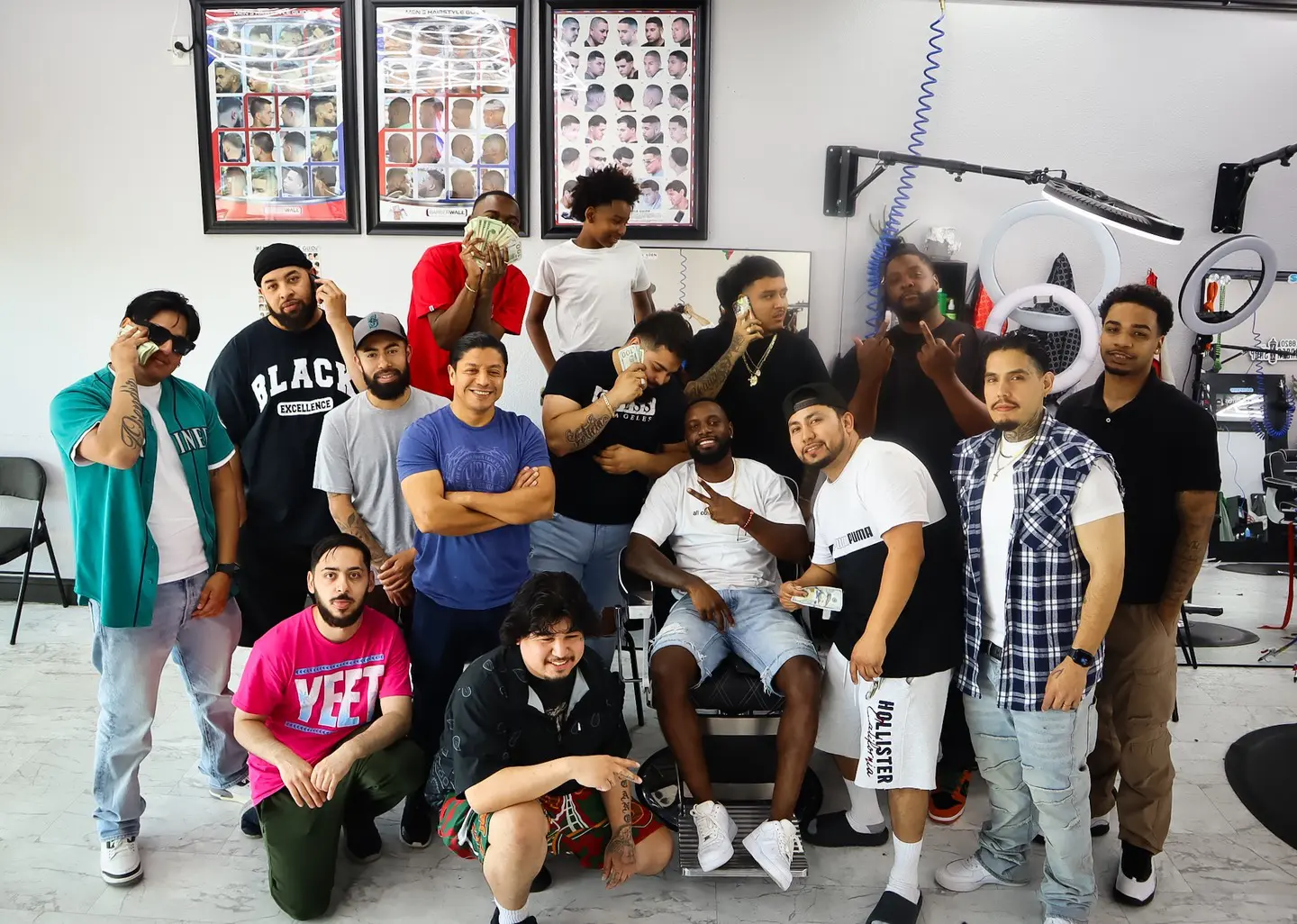 A lively group of friends posing together indoors, showing diverse styles and joyful expressions.